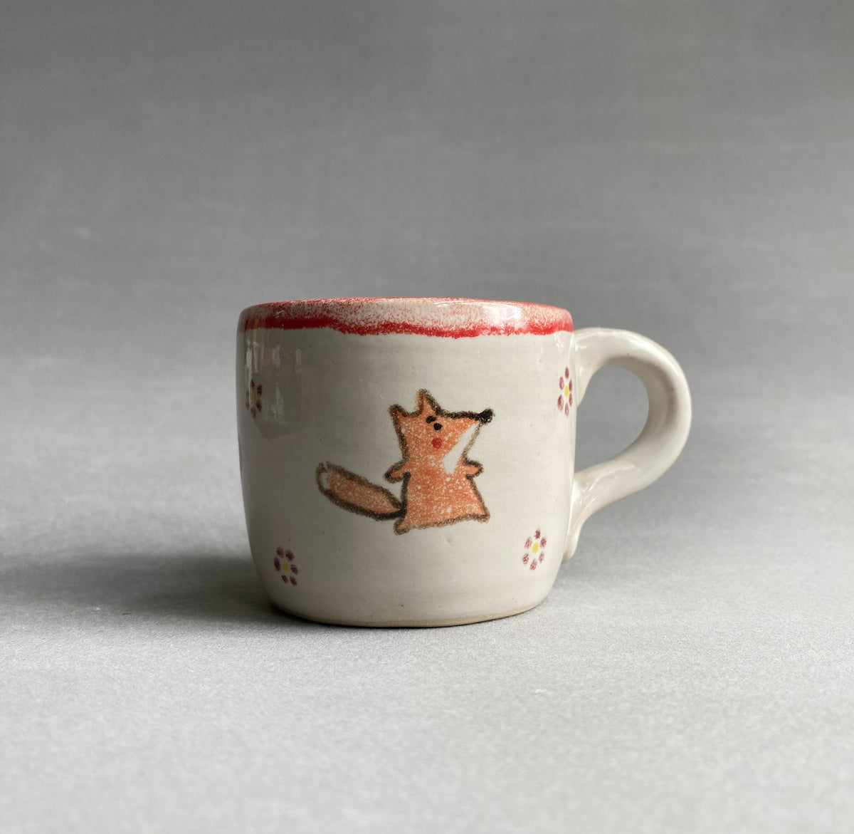 Tasse mit Tierchen